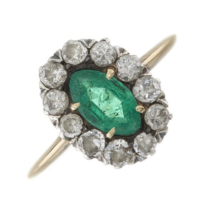 Lot 2 - An early 20th century gold emerald and diamond cluster ring