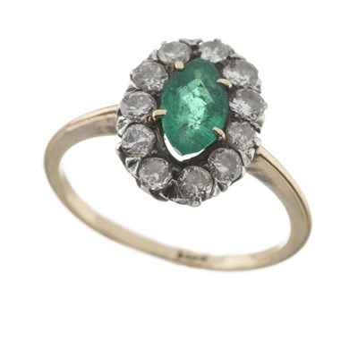 Lot 2 - An early 20th century gold emerald and diamond cluster ring