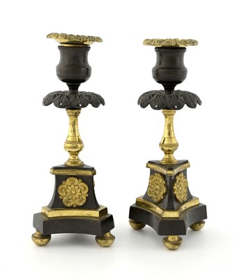 Lot 142 - A pair of bronze and gilt metal candelabra,...