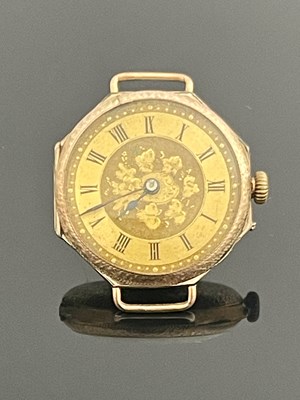 Lot 218 - A 9 carat gold ladies wristwatch, chased dial...