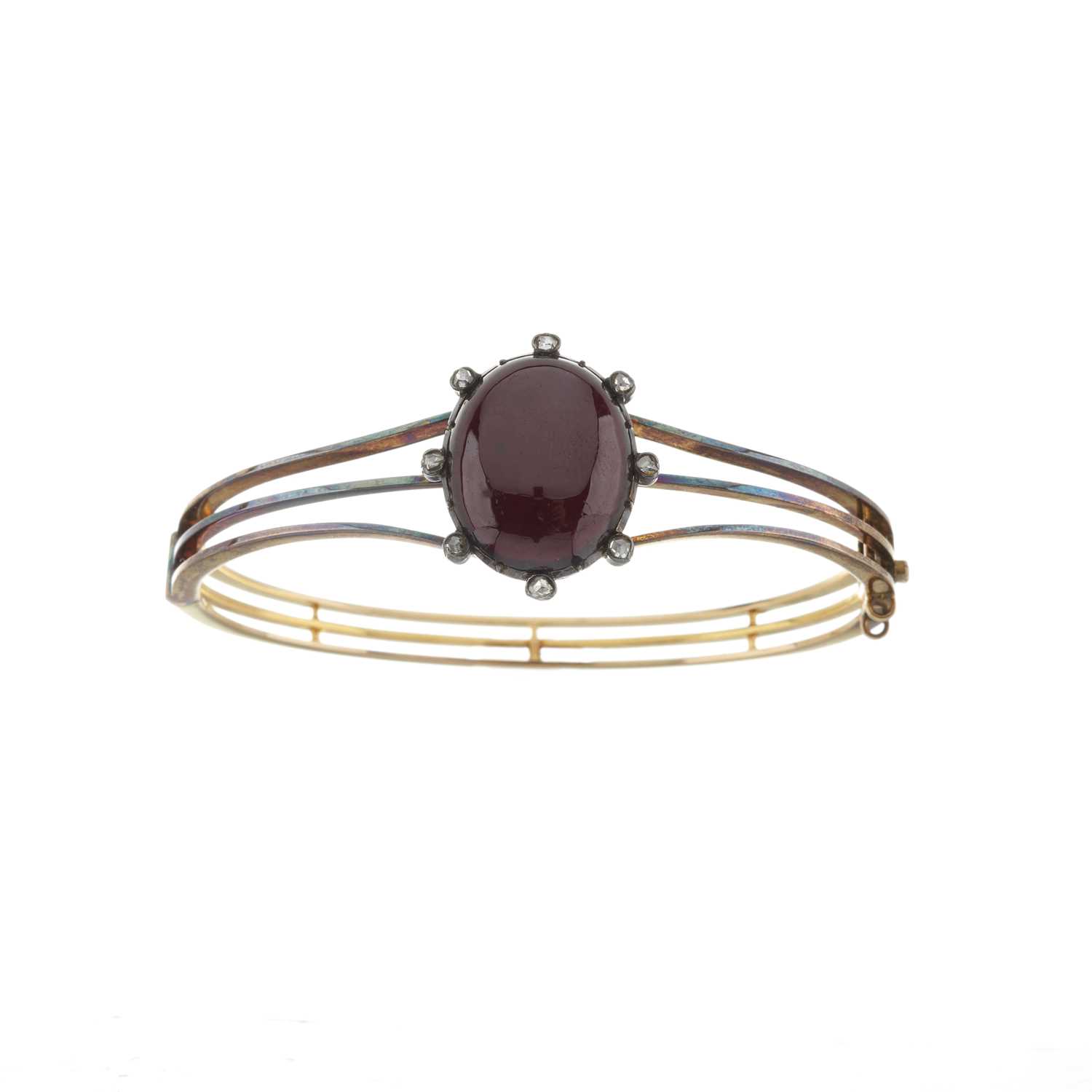 Lot 15 - A late Victorian gold garnet and diamond bangle bracelet