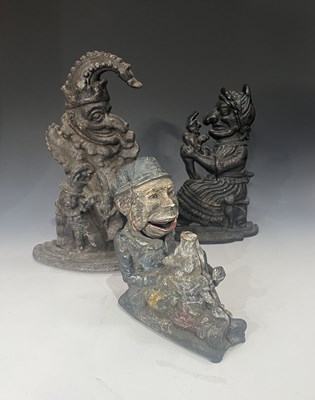 Lot 237 - A painted cast iron money bank in the form of '...