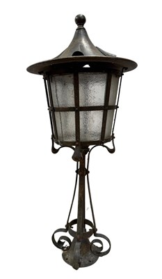 Lot 555 - An Arts and Crafts newel post lamp, in the...