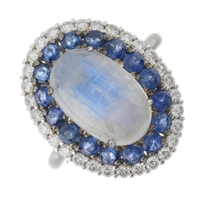 Lot 113 - A platinum moonstone, sapphire and brilliant-cut diamond cluster ring