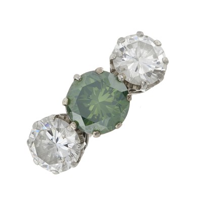 Lot 141 - An impressive green diamond and diamond three-stone ring