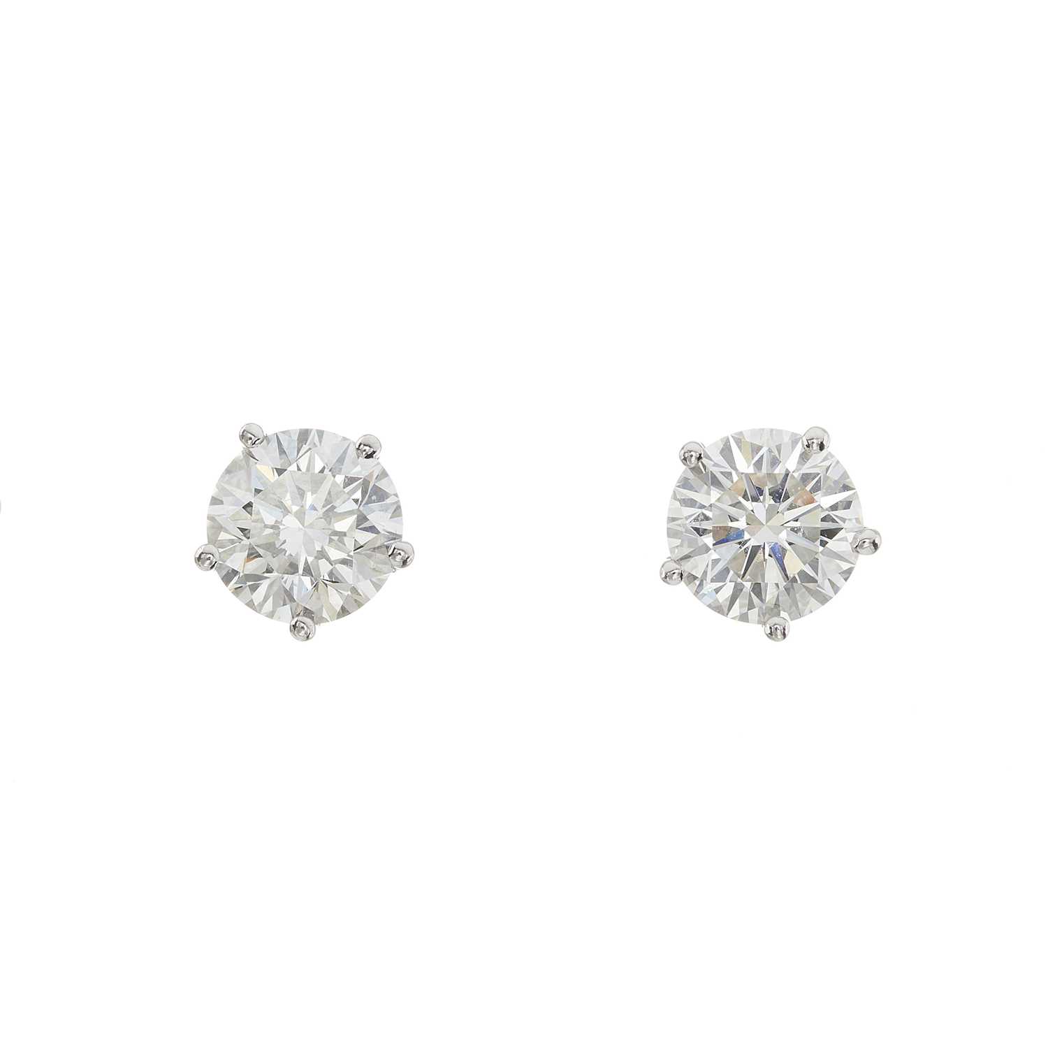 Lot 64 - A pair of 18ct gold diamond single-stone stud earrings