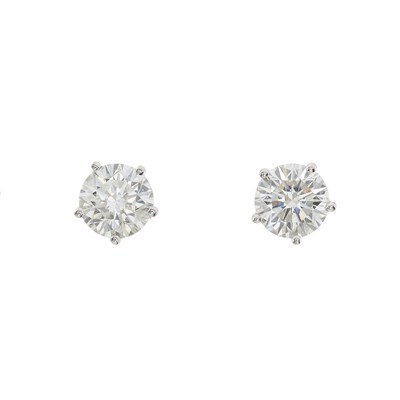 Lot 64 - A pair of 18ct gold diamond single-stone stud earrings