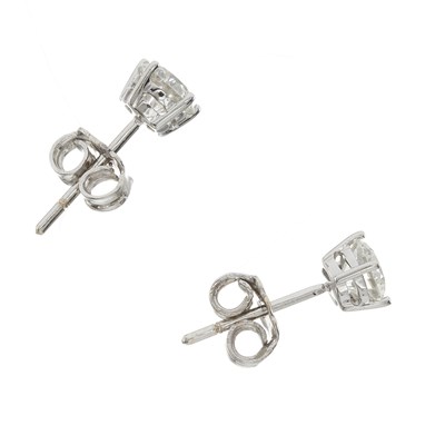 Lot 64 - A pair of 18ct gold diamond single-stone stud earrings