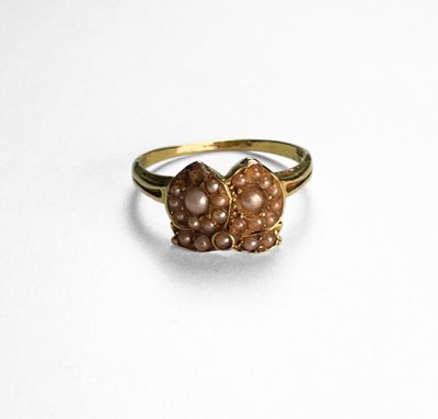 Lot 404 - An 18ct gold split pearl ring