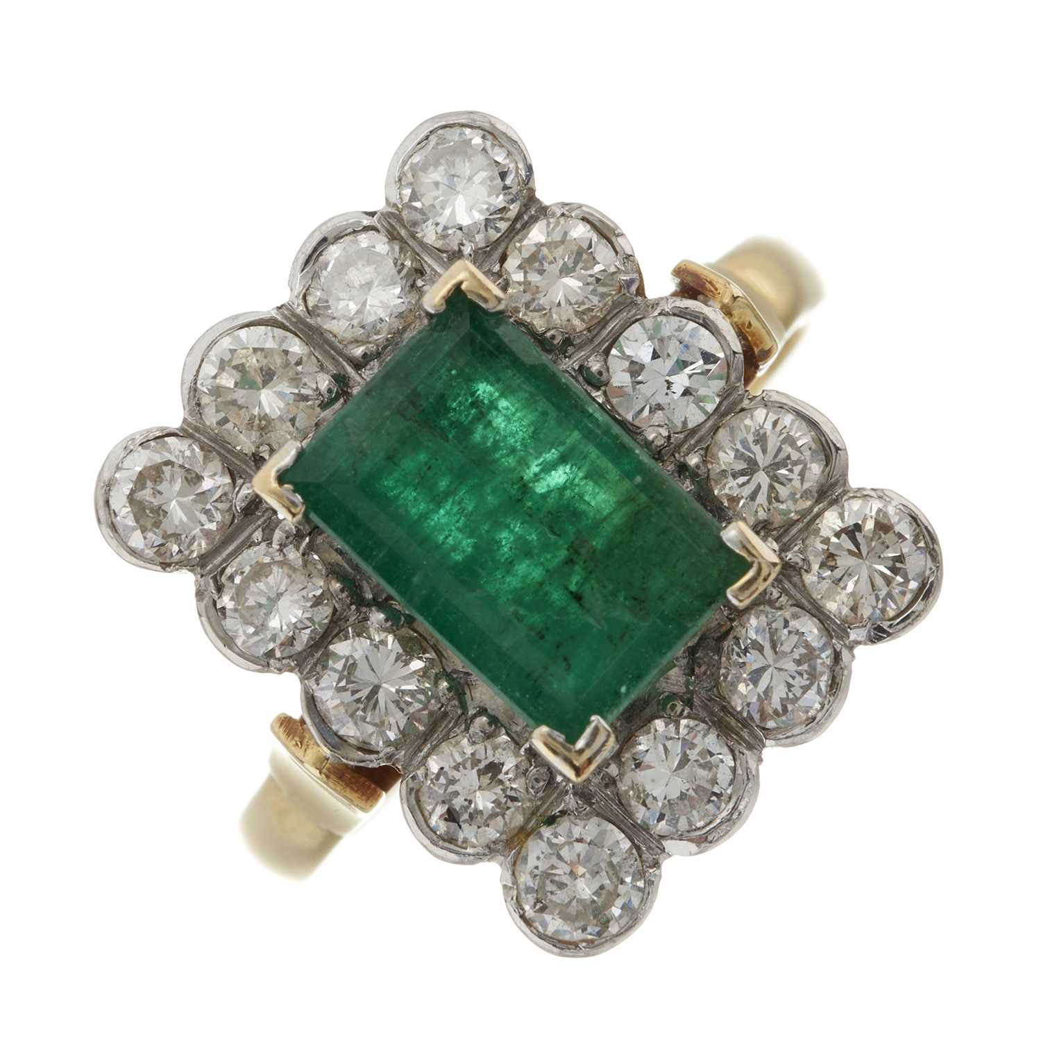 Lot 45 - An 18ct gold emerald and diamond cluster ring