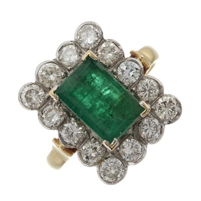 Lot 45 - An 18ct gold emerald and diamond cluster ring