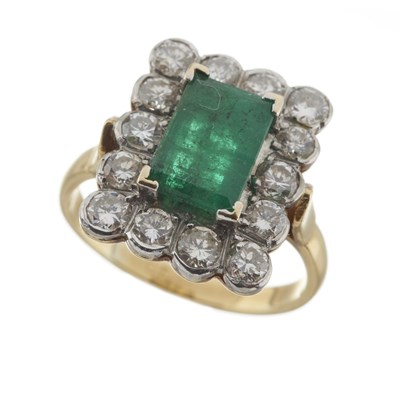 Lot 45 - An 18ct gold emerald and diamond cluster ring