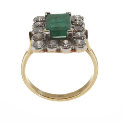 Lot 45 - An 18ct gold emerald and diamond cluster ring