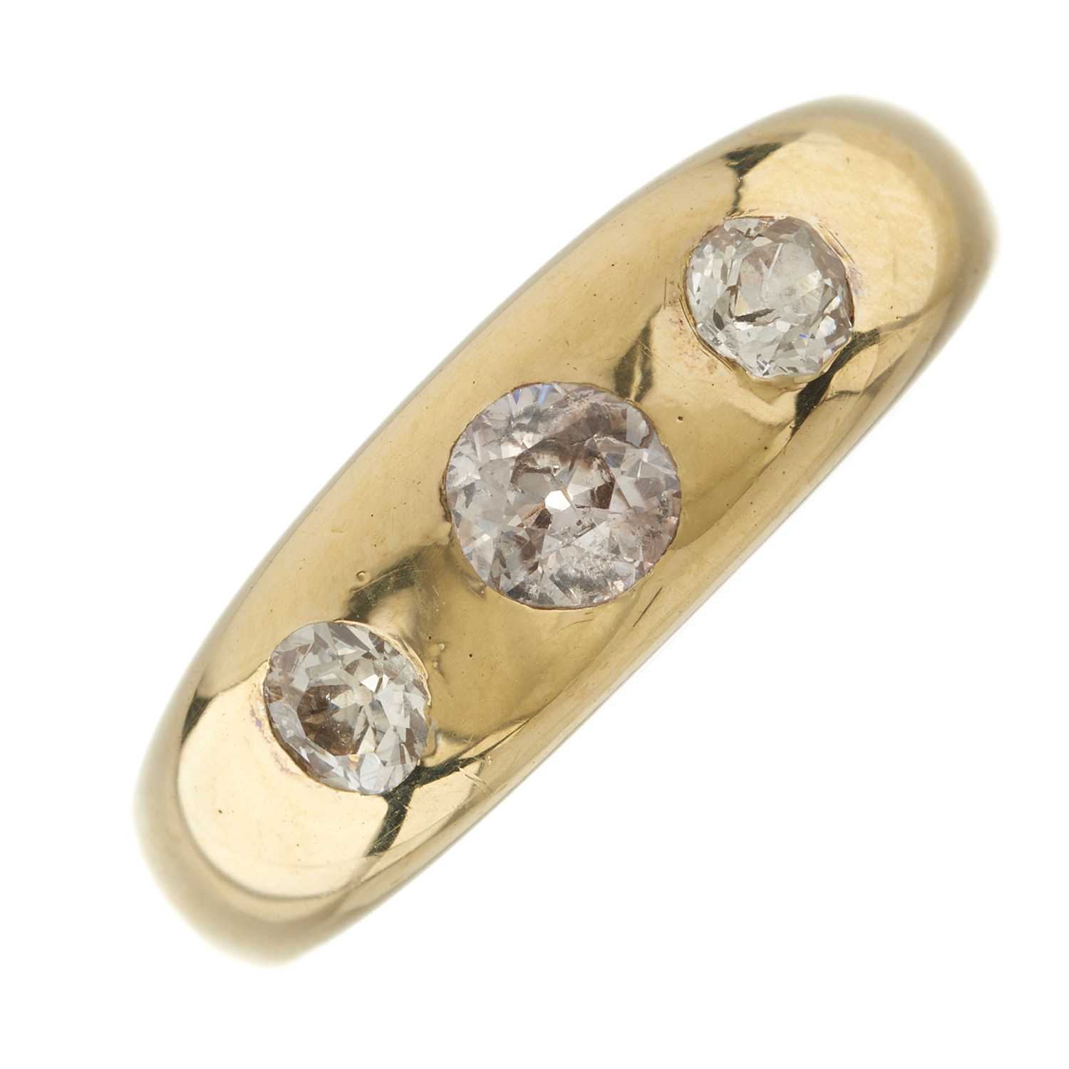 Lot 34 - An early 20th century 18ct gold diamond three-stone band ring
