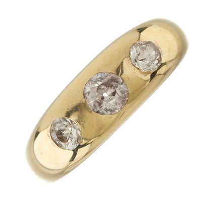 Lot 34 - An early 20th century 18ct gold diamond three-stone band ring