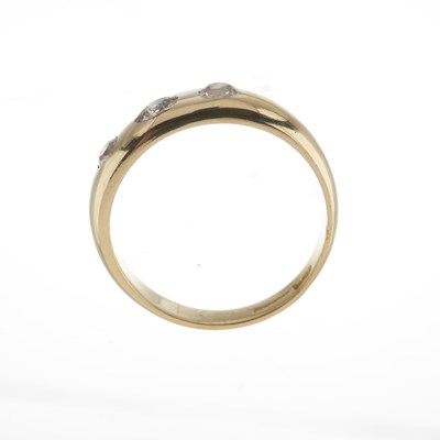 Lot 34 - An early 20th century 18ct gold diamond three-stone band ring