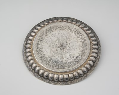 Lot 127 - An Indian parcel-gilt silver tray or thali,...