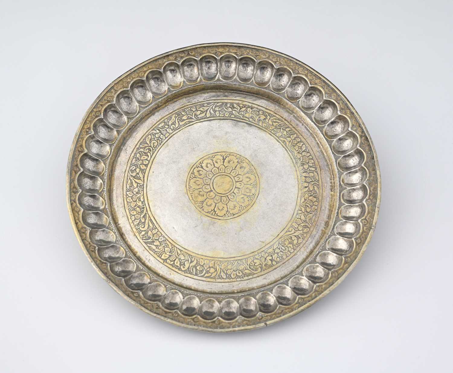 Lot 127 - An Indian parcel-gilt silver tray or thali,...