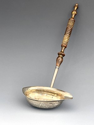 Lot 174 - A George III silver coin set ladle, Josiah...