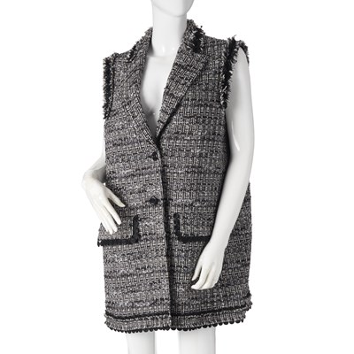 Lot 313 - Moschino Boutique, a sleeveless tweed jacket.