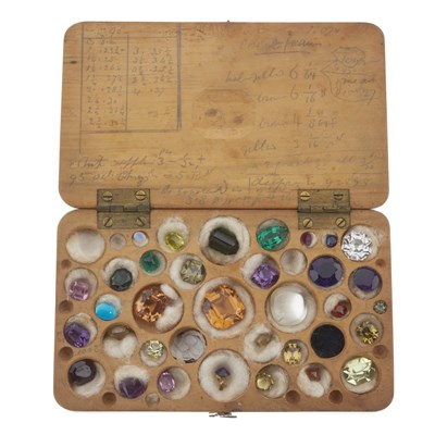 Lot 54 - A selection of loose gemstones in a wooden specimen box