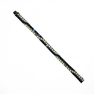 Lot 421 - A mid 20th century silver blue and colourless paste line bracelet