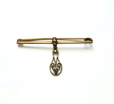 Lot 439 - An early 20th century diamond and split pearl bar brooch