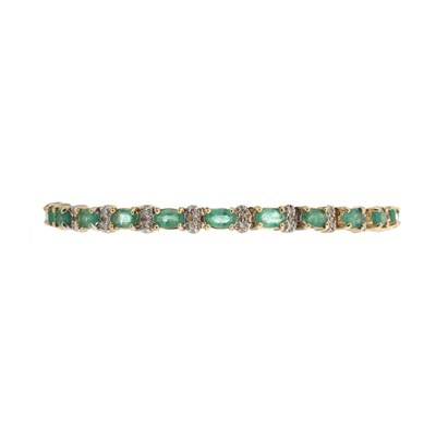Lot 96 - A 14ct gold emerald and diamond line bracelet