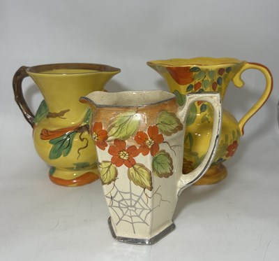 Lot 59 - A collection of mostly early mid-century jugs...