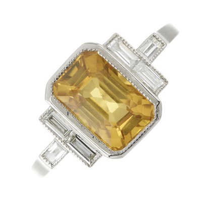 Lot 121 - A platinum yellow sapphire and diamond dress ring