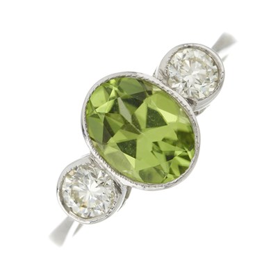 Lot 111 - A platinum peridot and diamond three-stone ring