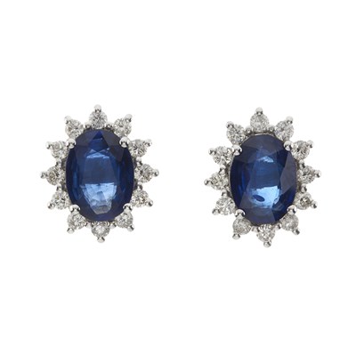 Lot 114 - A pair of 18ct gold sapphire and diamond cluster stud earrings