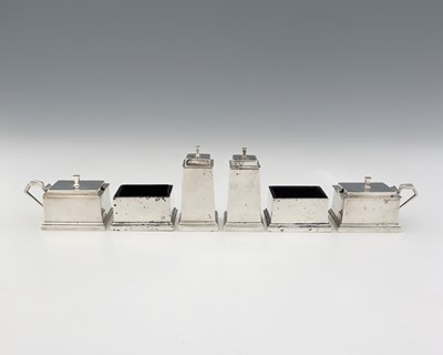 Lot 355 - An Edward VII Art Deco silver cruet set,...