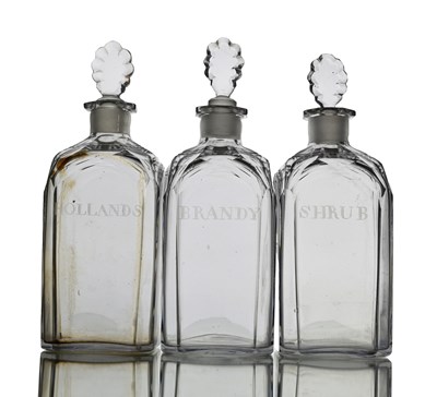 Lot 400 - Three facet cut glass spirit decanters, circa...
