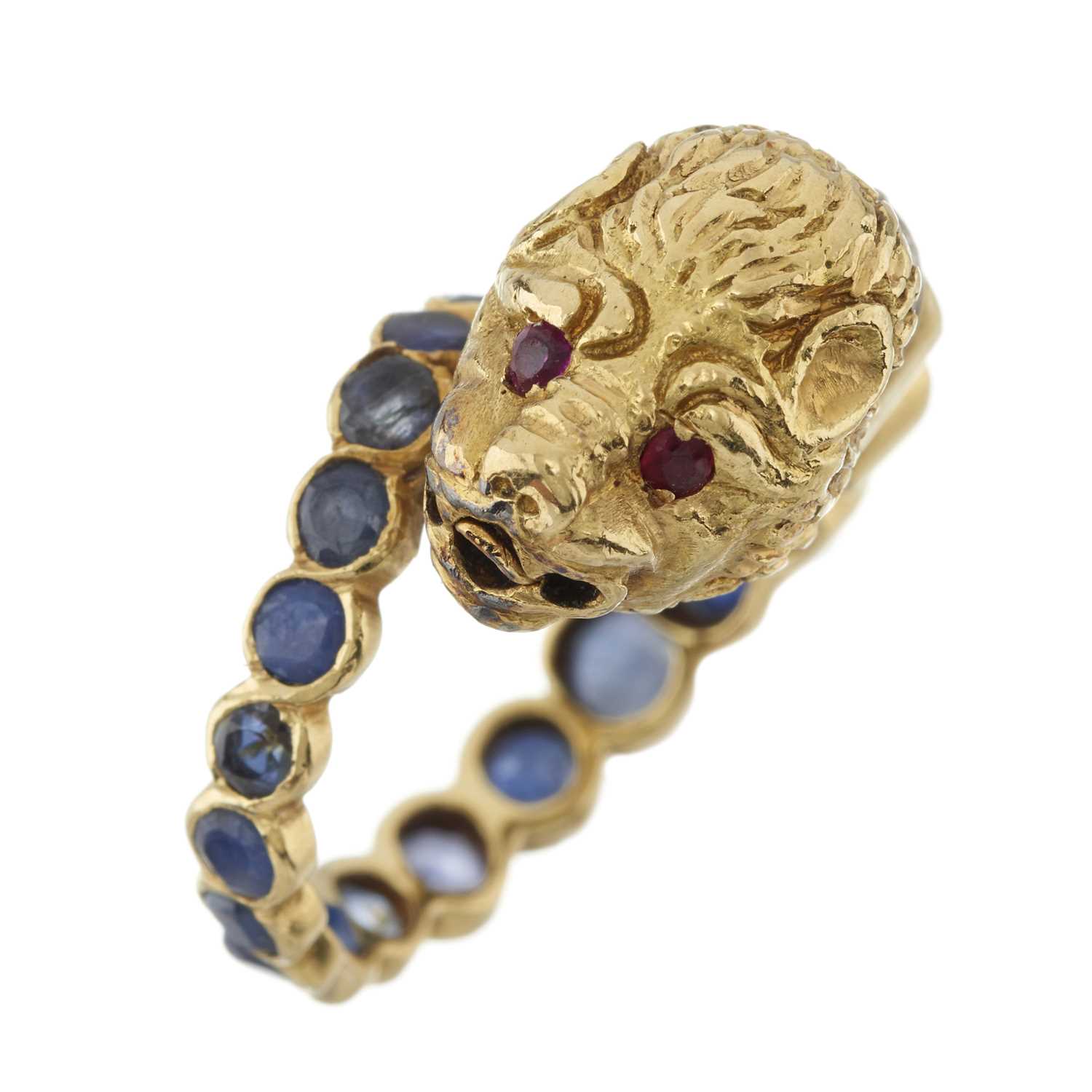 Lot 72 - Zolotas (attr.), an 18ct gold sapphire, ruby and diamond lion's head bypass ring