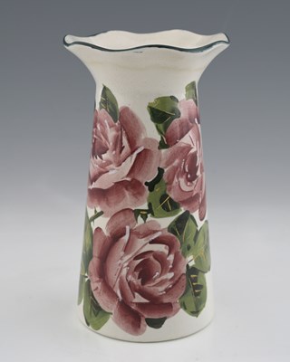Lot 484 - A Wemyss art pottery vase, conical form with...