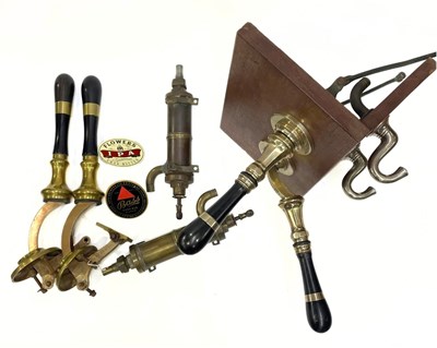 Lot 28 - A pair of J Warne pub beer taps, with brass...