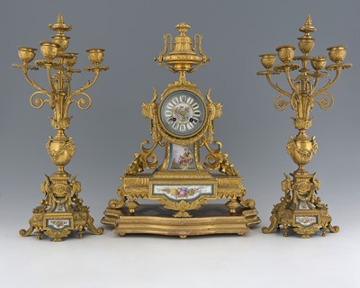 Lot 383 - A French ormolu and Sevres style plaque set...