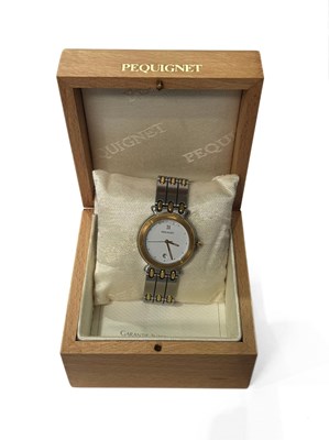 Lot 470 - A bi-colour quartz Pequignet bracelet watch
