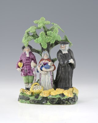 Lot 604 - A Staffordshire pearlware Tithe Pig figure...