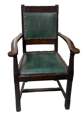 Lot 570A - An Arts and Crafts dark oak armchair, green...
