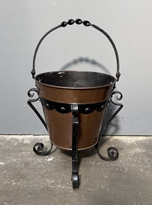 Lot 556 - An Arts and Crafts copper and cast iron...