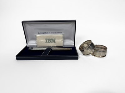 Lot 486 - Two hallmarked silver napkin rings, together...