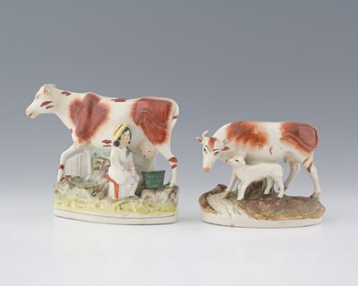 Lot 598 - Two Staffordshire cow figure groups, one...