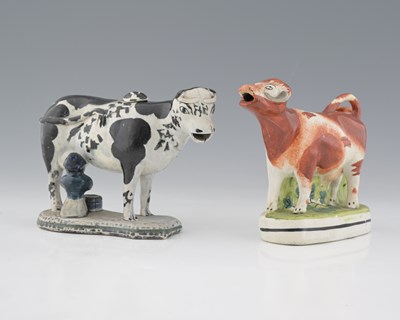 Lot 600 - A Yorkshire pottery cow creamer with milkmaid,...