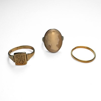 Lot 406 - A 22ct gold band ring and two 9ct gold rings