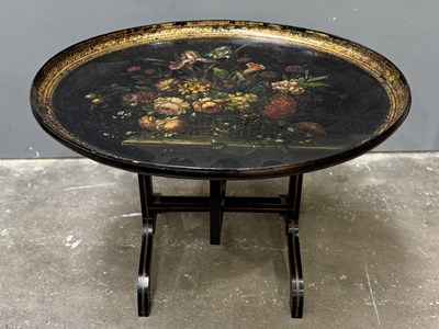 Lot 588 - A 19th century ebonised and painted tray...