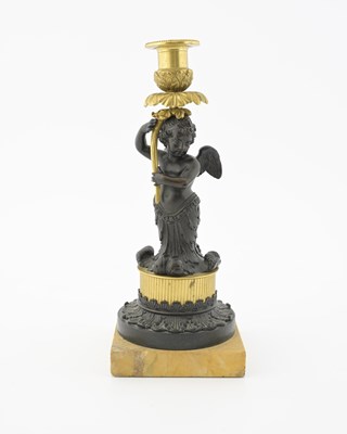 Lot 168 - A bronze and ormolu figural candlestick,...