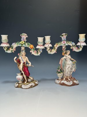 Lot 119 - A pair of Dresden type two-light candelabra,...