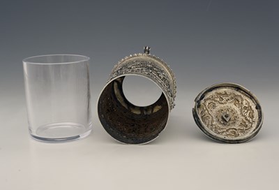 Lot 59 - A Burmese silver-coloured metal jar and cover...